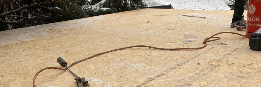 Flat roof deck being prepared