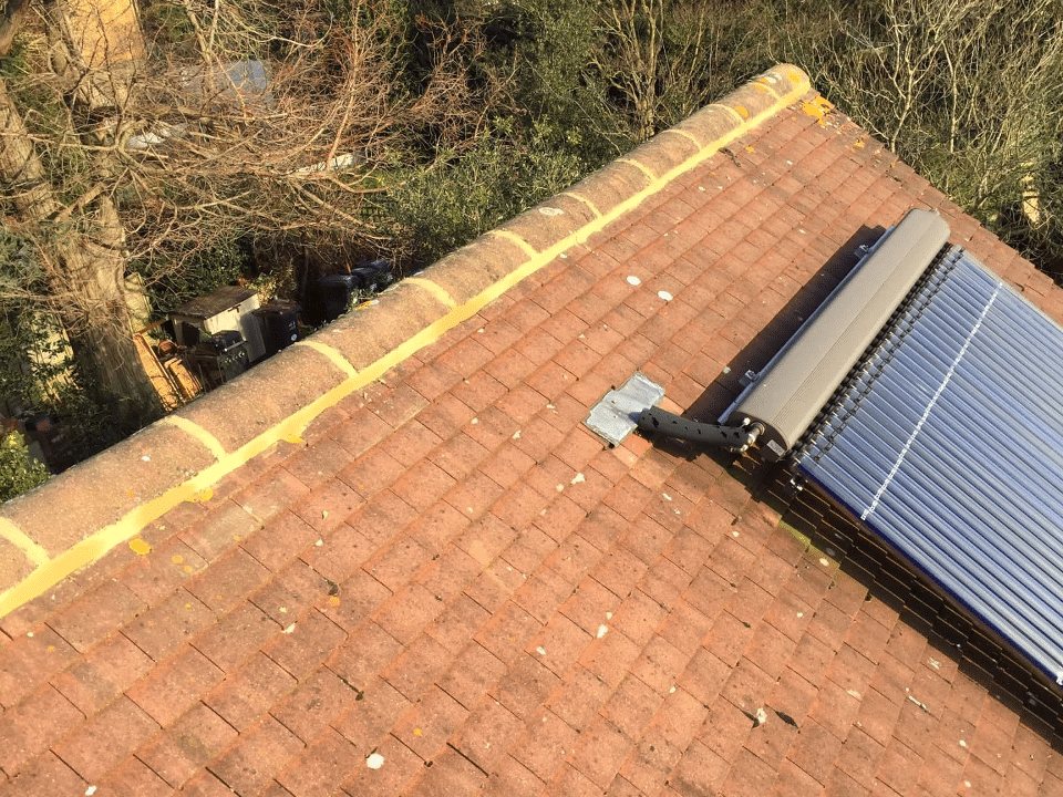 Tiled roof with new ridge and solar panels