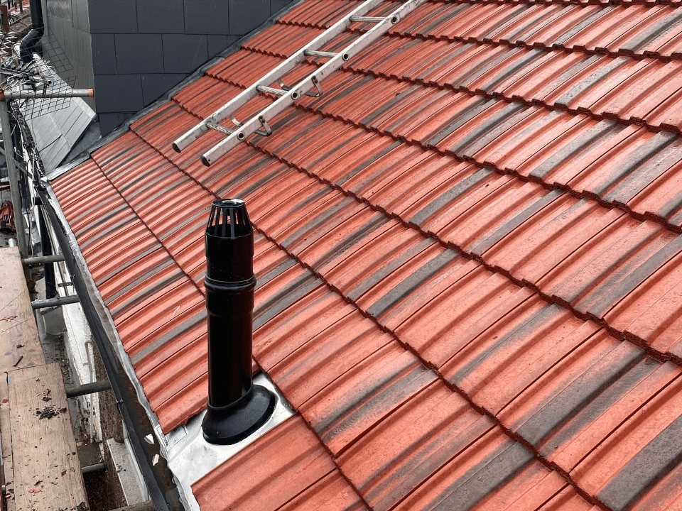 Red tiled roof with a new vent terminal